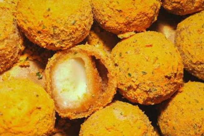 Cheese-filled BHC Chicken bites, one cut open to show the melted cheese center