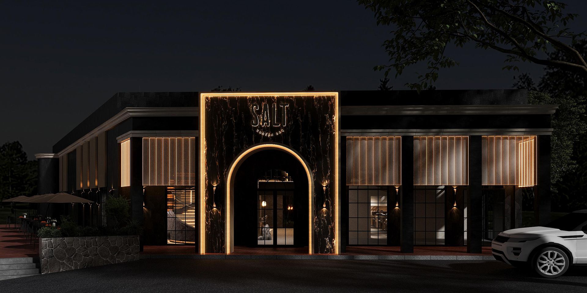 Night rendering of the second SALT Korean BBQ: a dark stone facade with a glowing brass arch entrance